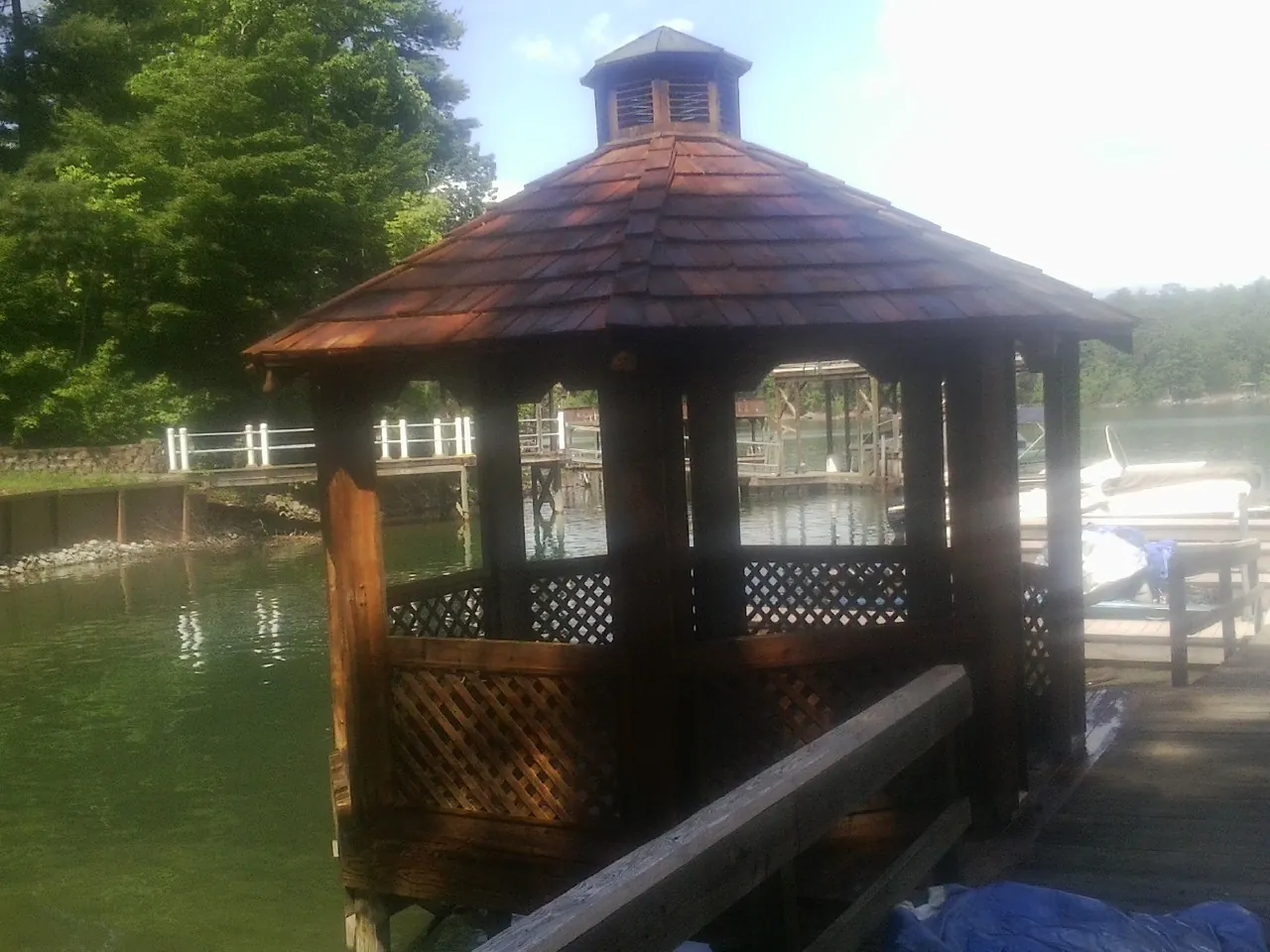Cedar shake gazebo roof rebuilt on a lake dock in Imogene
